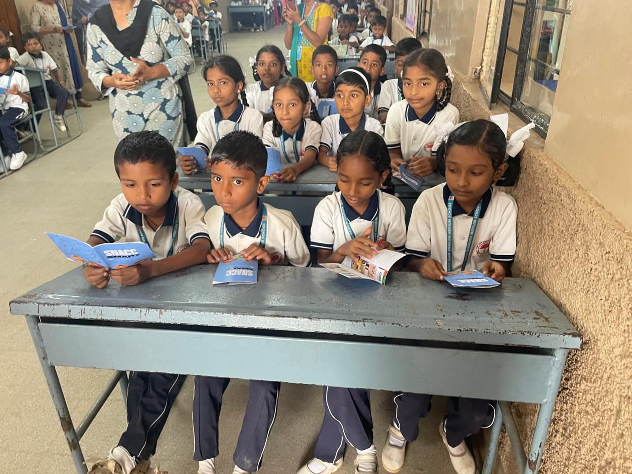 Students reading the journal, Hubli