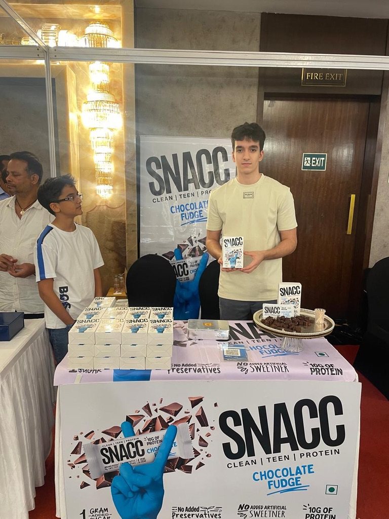 Rayhan at the SNACC stall, Helping Hands Exhibition #1