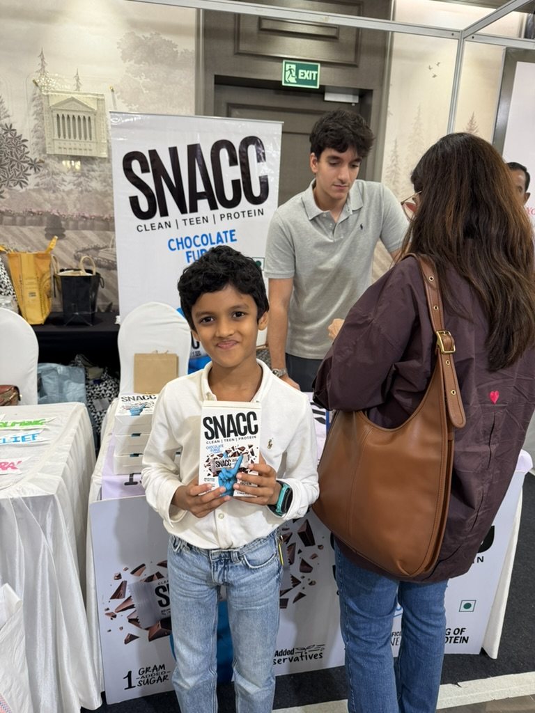 A young customer with a box of SNACC